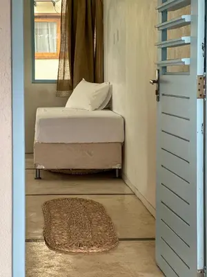 Uma cama ou camas num quarto em Vento do Ceará -Kitesurfing House- Preá