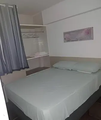 Uma cama ou camas num quarto em Flat Grand Praia de Iracema