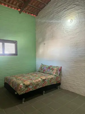 Uma cama ou camas num quarto em Casa com piscina próxima a praia de Águas Belas