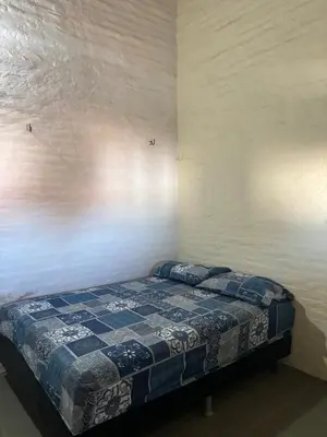 Uma cama ou camas num quarto em Casa com piscina próxima a praia de Águas Belas