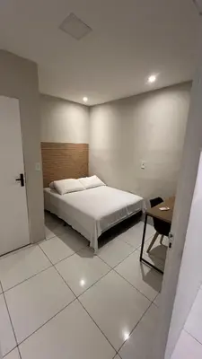 Uma cama ou camas num quarto em Pousada Meu Aconchego