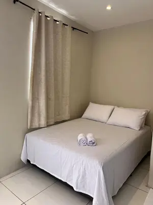 Uma cama ou camas num quarto em Pousada Meu Aconchego