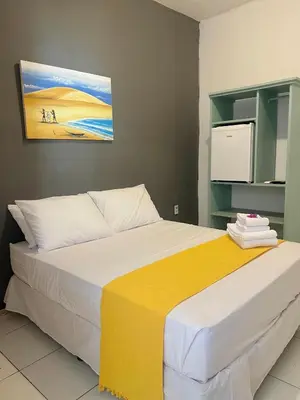 Uma cama ou camas num quarto em Vila do Sol Pousada