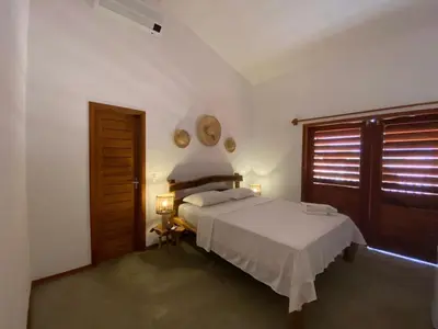 Uma cama ou camas num quarto em Suítes em praça pontal de Maceió
