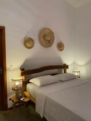 Uma cama ou camas num quarto em Suítes em praça pontal de Maceió
