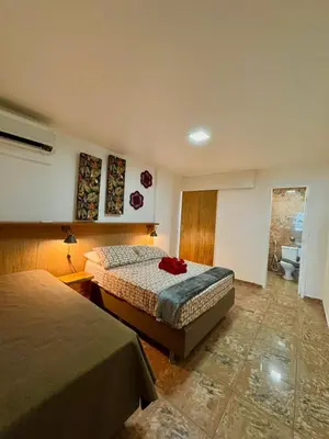 Uma cama ou camas num quarto em Beira Mar - Apartamento COM VISTA e SEM VISTA MAR