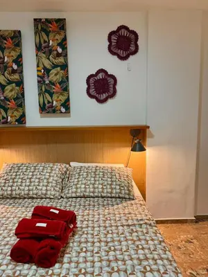 Uma cama ou camas num quarto em Beira Mar - Apartamento COM VISTA e SEM VISTA MAR