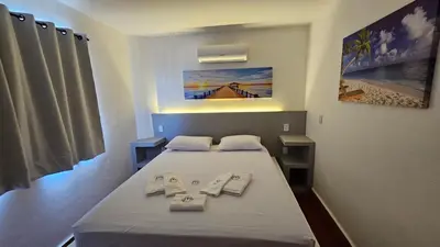 Uma cama ou camas num quarto em Chalés Mediterraneo