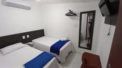 Uma cama ou camas num quarto em Casa da Lalá