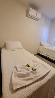 Uma cama ou camas num quarto em Canoa Breeze - Apartment Roof Top