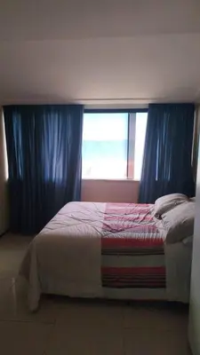 Uma cama ou camas num quarto em Cobertura Praia do Futuro