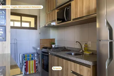 A cozinha ou kitchenette de Último andar no VG Sun com acesso a praia