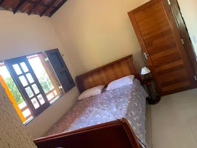 Uma cama ou camas num quarto em Chalé dos Pássaros - Guaramiranga