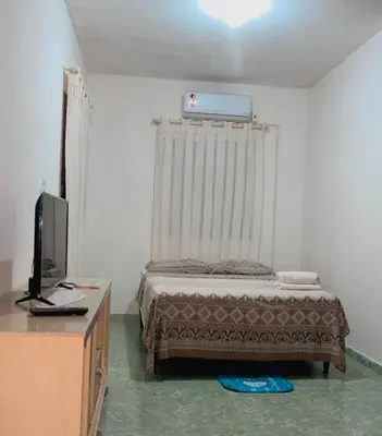 Uma cama ou camas num quarto em Chalé R&M