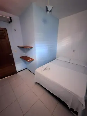 Uma cama ou camas num quarto em Pousada São João