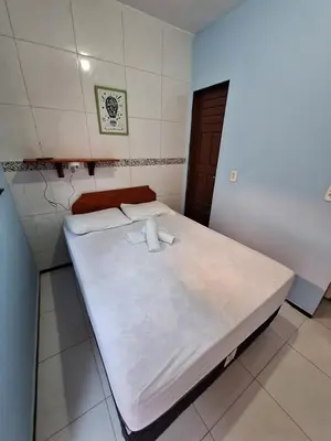 Uma cama ou camas num quarto em Pousada São João