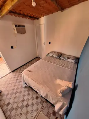 Uma cama ou camas num quarto em Pousada São João