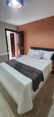 Uma cama ou camas num quarto em recanto da Juliana