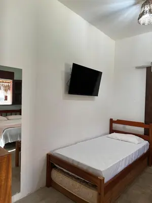 Uma cama ou camas num quarto em Vila Lua Aparts - Apartamento 1