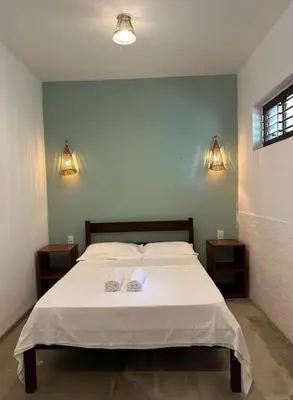 Uma cama ou camas num quarto em Vila Lua Aparts - Apartamento 4