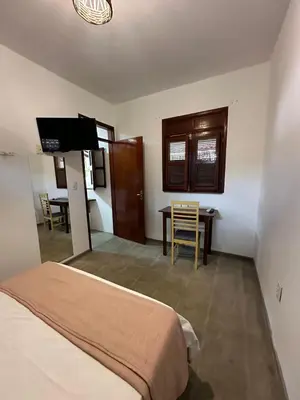 Uma cama ou camas num quarto em Vila Lua Aparts - Apartamento 6