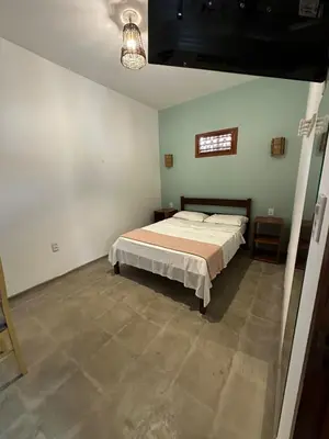 Uma cama ou camas num quarto em Vila Lua Aparts - Apartamento 6
