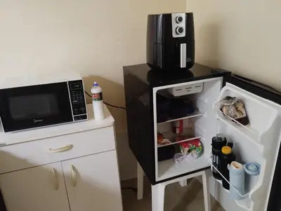 A cozinha ou kitchenette de Casa próximo centro de eventos com ar condicionado