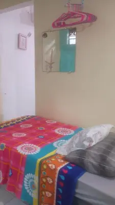 Uma cama ou camas num quarto em Casa de temporada Fortaleza