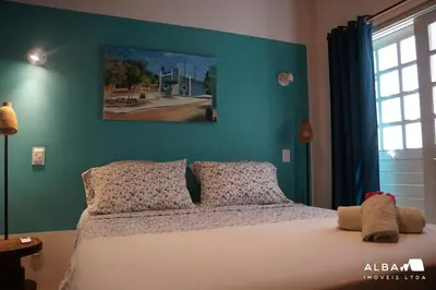 Uma cama ou camas num quarto em Casa Minerva Pontal
