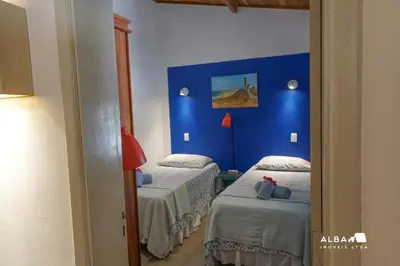 Uma cama ou camas num quarto em Casa Minerva Pontal