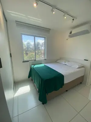 Uma cama ou camas num quarto em CN Porto das Dunas Beach
