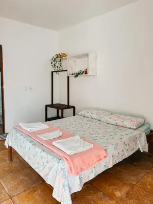 Uma cama ou camas num quarto em Pousada Recanto dos Ventos