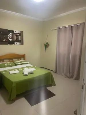 Uma cama ou camas num quarto em Casa da mae