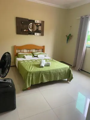 Uma cama ou camas num quarto em Casa da mae