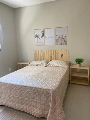 Uma cama ou camas num quarto em Casa Tibau