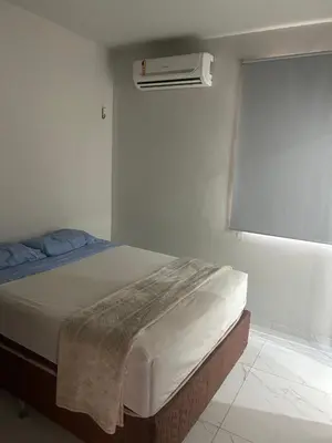 Uma cama ou camas num quarto em GT Hostel