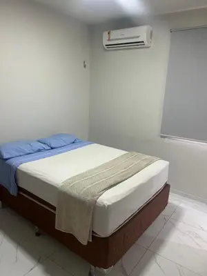 Uma cama ou camas num quarto em GT Hostel