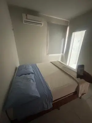 Uma cama ou camas num quarto em GT Hostel