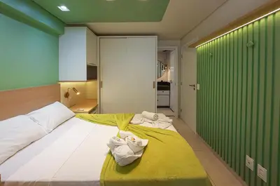 Uma cama ou camas num quarto em Flat Luxo 4 Pessoas 500m Praia Meireles Compact