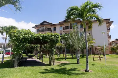 Um jardim no exterior de VG Sun Cumbuco Térreo WiFi Ar Cond 4 Pessoas