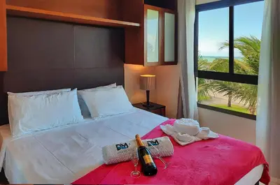 Uma cama ou camas num quarto em VG Sun Cumbuco Nascente Vista Mar 4 Pessoas