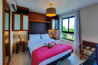 Uma cama ou camas num quarto em VG Sun Cumbuco Nascente Vista Mar 4 Pessoas