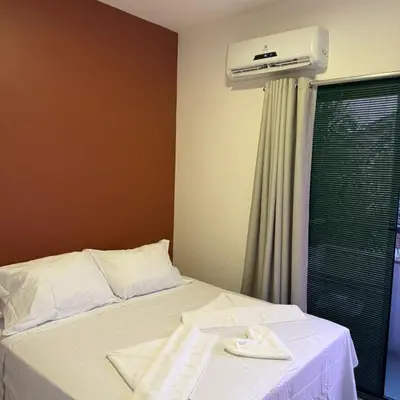 Uma cama ou camas num quarto em Triplex Flecheiras