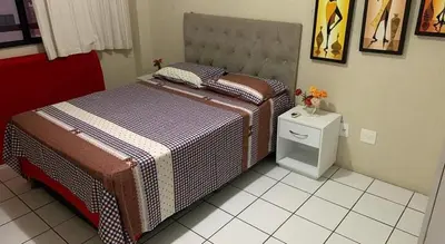 Uma cama ou camas num quarto em Apartamento Costa do Sol