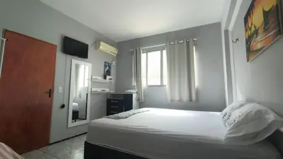 Uma cama ou camas num quarto em Brisa Mar