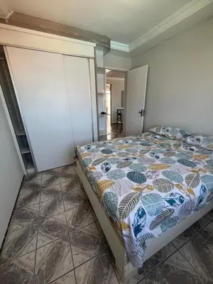 Uma cama ou camas num quarto em Condomínio Vista Mar