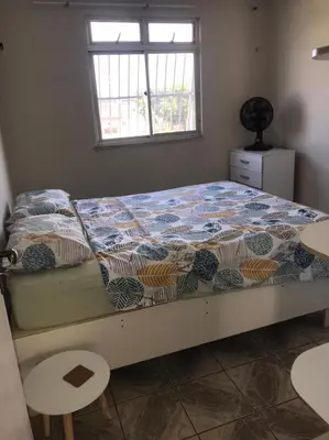 Uma cama ou camas num quarto em Condomínio Vista Mar