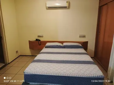 Uma cama ou camas num quarto em PERTO DE TUDO, Praia Mansa 4