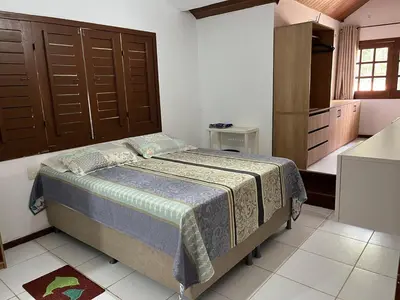 Uma cama ou camas num quarto em Casa em Guaramiranga com Jacuzzi privativa