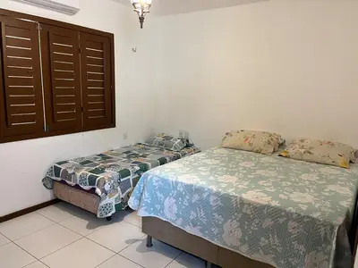 Uma cama ou camas num quarto em Casa em Guaramiranga com Jacuzzi privativa